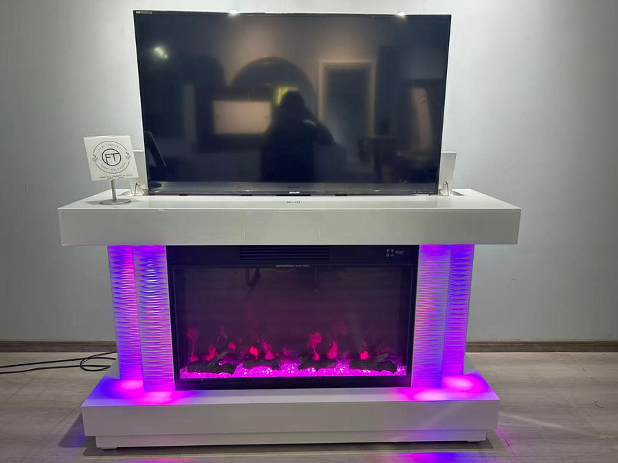 White entertainment console with LED lights displaying a TV and fireplace effect.