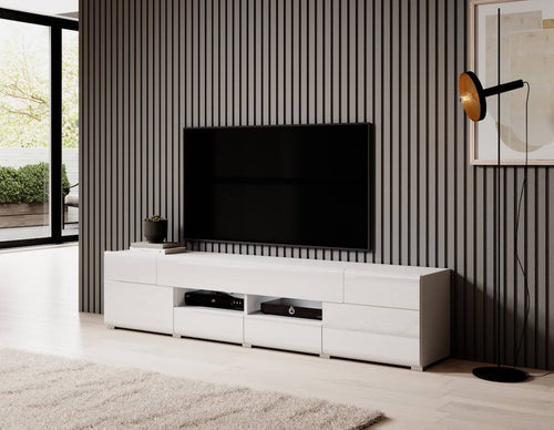 Modern living room with a white entertainment console and black TV against a striped wall.