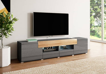 Modern TV stand with a television mounted on a wall in a living room.