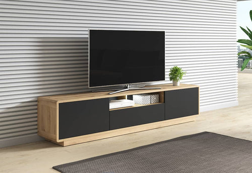Modern TV stand with a television on a neutral wall background