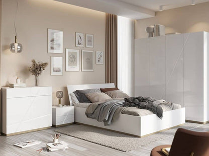 Modern bedroom with a bed, nightstands, and wall art in a neutral color scheme.