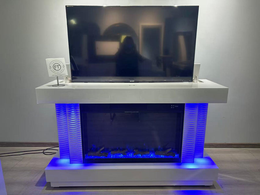 Modern entertainment console with TV and LED lighting in a room.