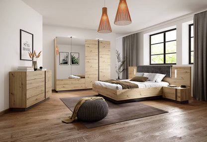 Modern bedroom with wooden furniture including a bed, dresser, and mirror.