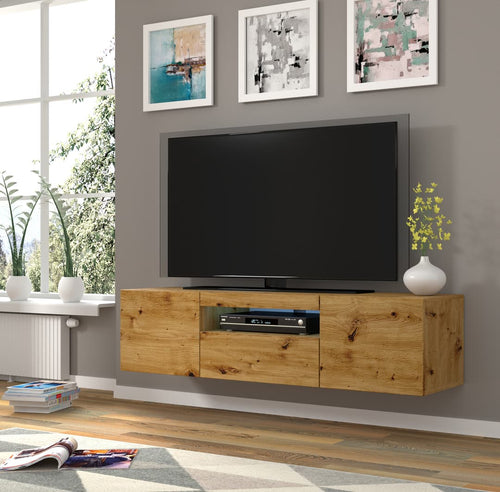 Wooden TV stand with a television mounted on a gray wall with decorative frames.
