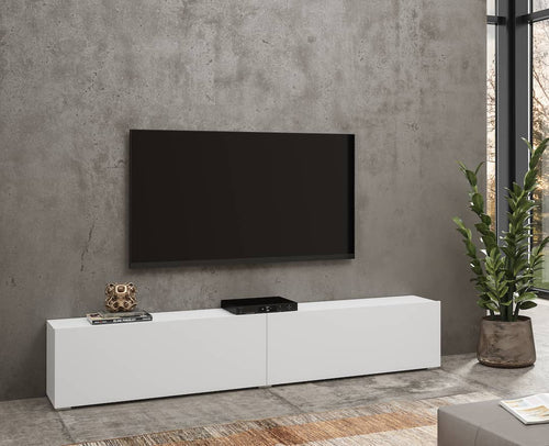 Modern living room with a white TV stand, black TV, and decorative items.