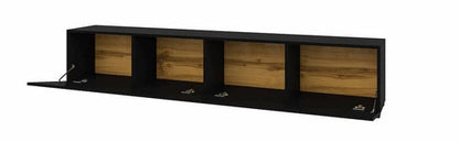 Modern black wall-mounted TV unit with oak wood accents and drop-down doors, featuring sleek compartments for stylish media storage. 