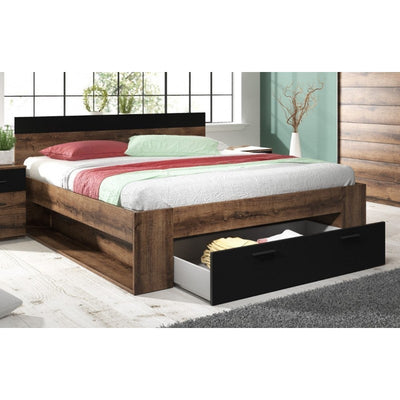 Wooden bed with storage drawers in a room setting