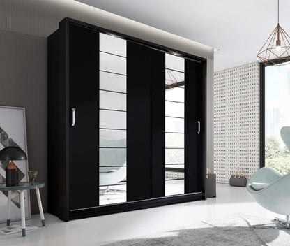 Modern black wardrobe with sliding doors in a stylish room.