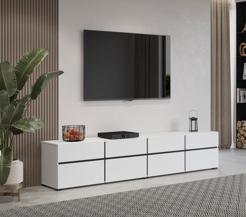 Modern living room with a white entertainment console, TV, and decorative items.