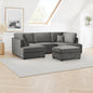 Gray sectional sofa with ottoman in a living room setting.