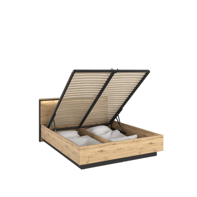 Wooden bed frame with open lid showing bedding on a transparent background