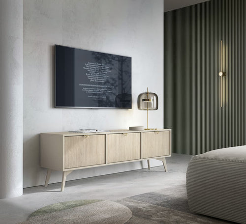 Modern living room with a television mounted on the wall above a wooden sideboard.