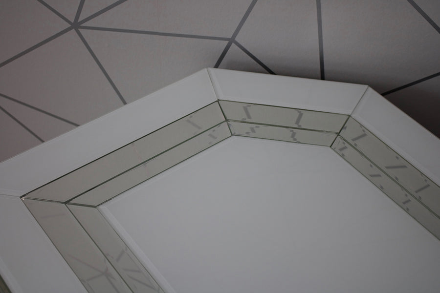 Hexagonal shower enclosure with tiled floor and wall