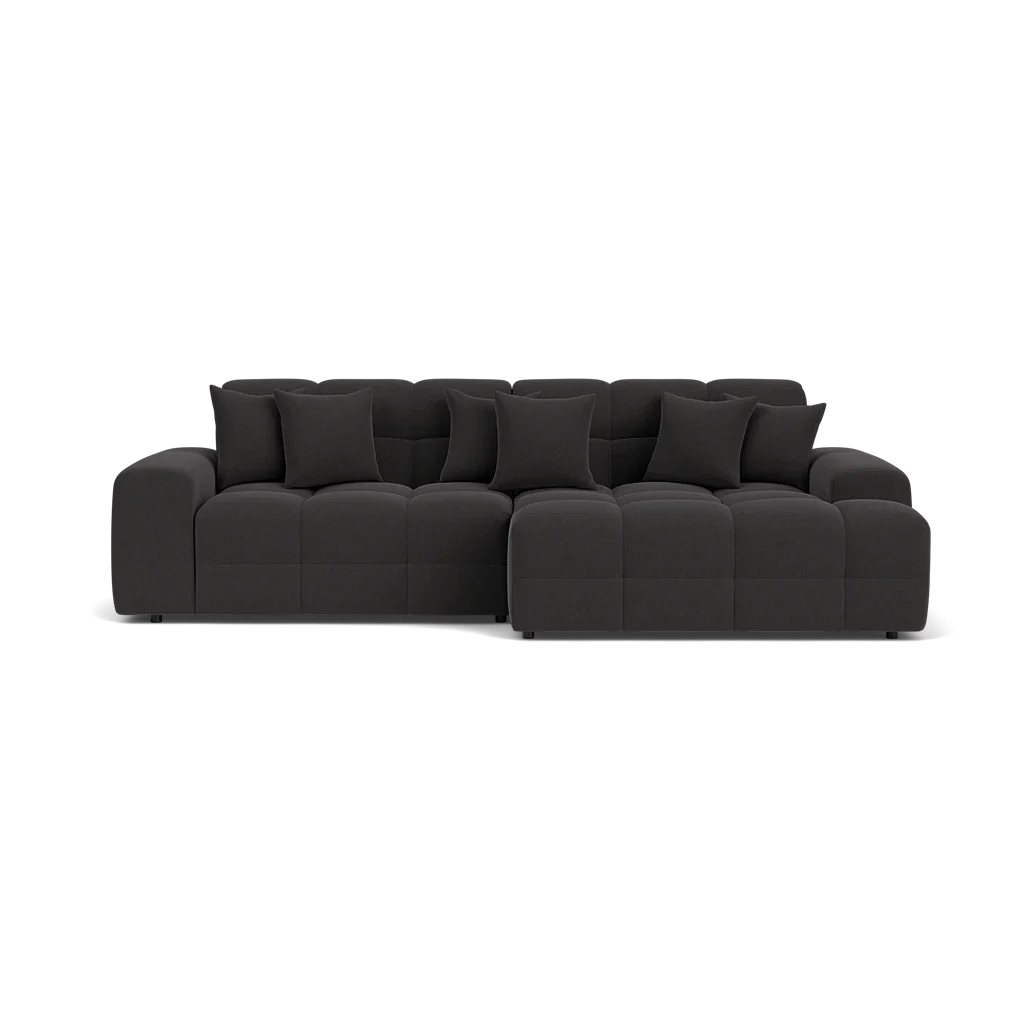 Black sectional sofa on a white background