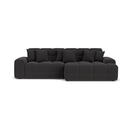 Black sectional sofa on a white background