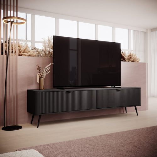Modern black TV stand with a large flat-screen TV in a living room setting.