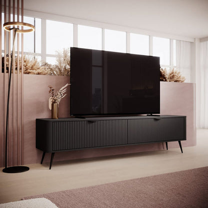 Modern black TV stand with a large flat-screen TV in a living room setting.