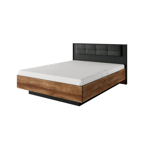 Wooden bed frame with black headboard and white mattress on a white background
