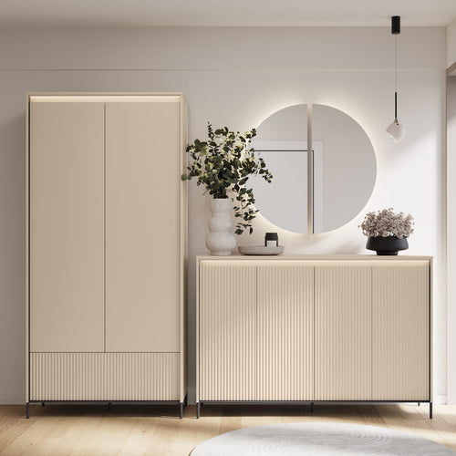 Modern interior with a beige wardrobe and sideboard against a light gray wall.