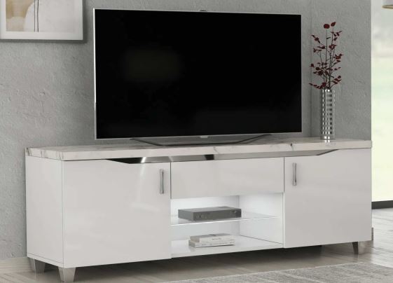 White TV stand with a black television on a gray wall background