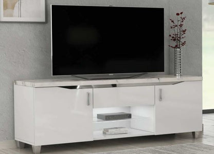White TV stand with a black television on a gray wall background