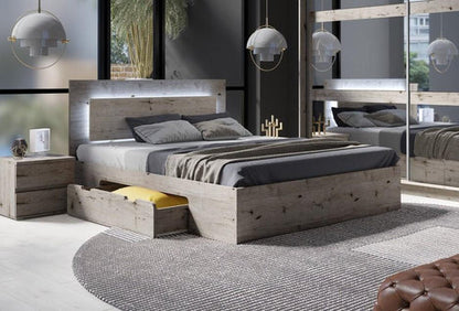Modern bedroom with wooden bed, nightstands, and decorative elements.