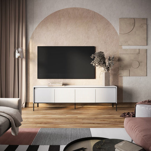 Modern living room with a television mounted on a decorative wall.