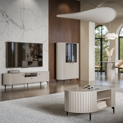 Modern living room with a television, cabinets, and a coffee table.