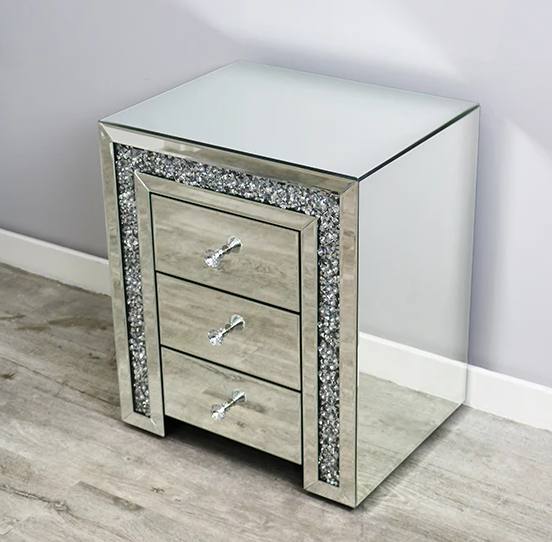 Mirrored nightstand with crystal embellishments on a wooden floor.