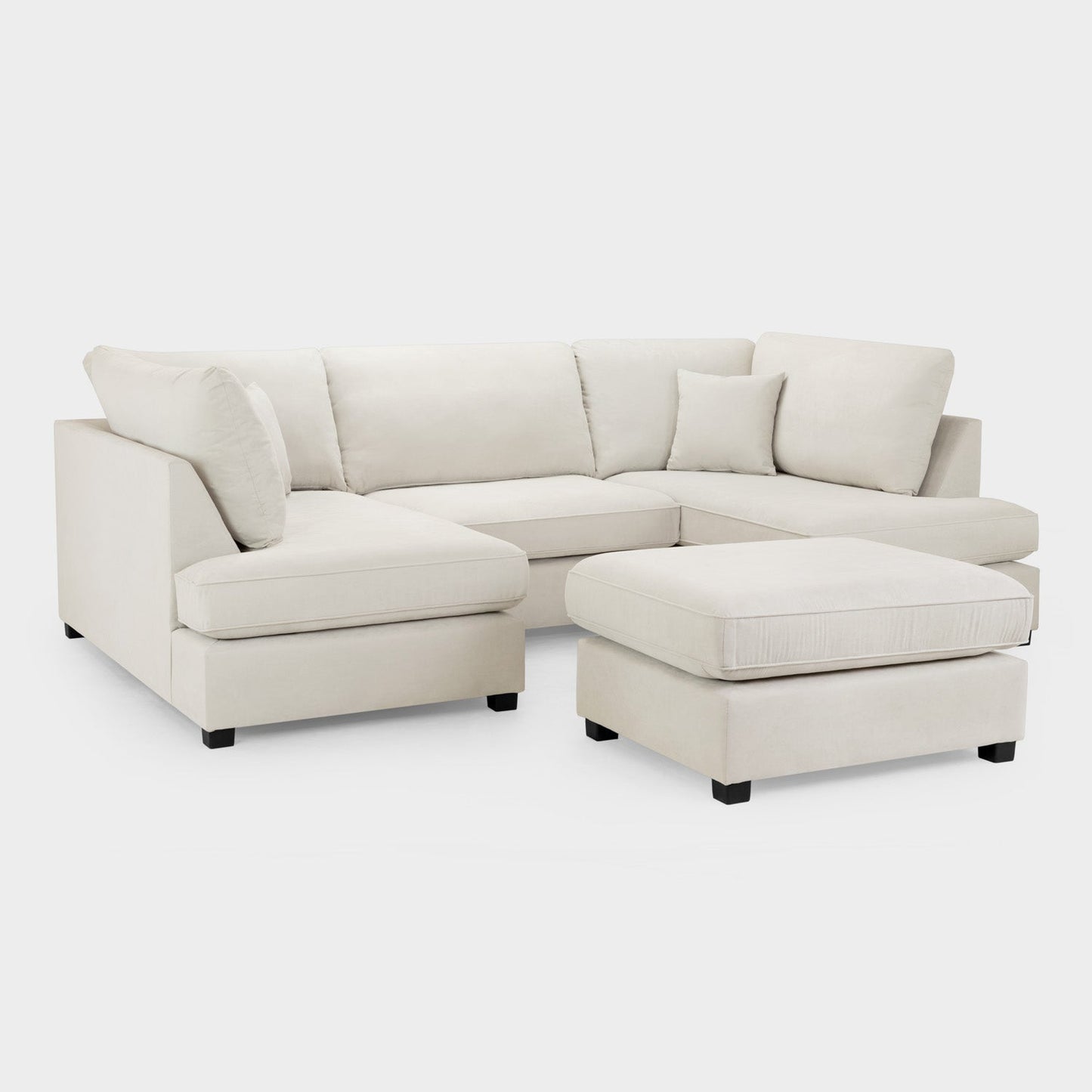 Beige sectional sofa with ottoman on a white background