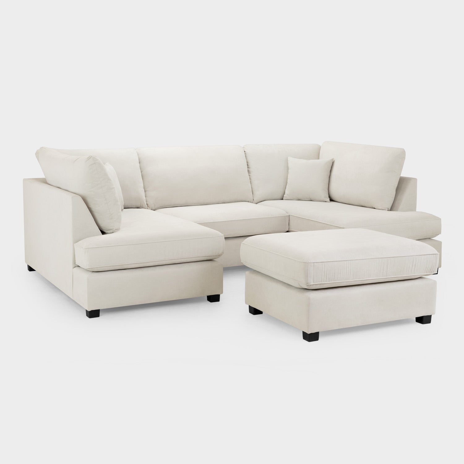 Beige sectional sofa with ottoman on a white background