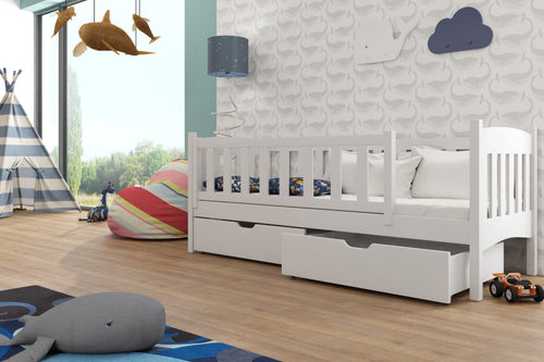 Children's room with a white bed, toys, and decorative elements.