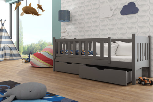 Children's bedroom with a gray bed, toys, and colorful decor.