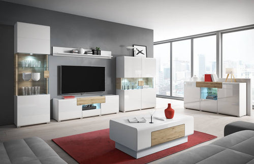 Modern living room with white and gray furniture, including a TV stand and sofa.
